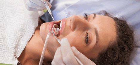 Dentist examining teeth